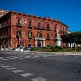 All�incrocio con la citata piazza Massari fa angolo un altro gioiello ottocentesco: palazzo Diana. Il fabbricato di un caratteristico colore rossastro fu prima la residenza del sindaco Massenzio Filo della Torre, poi banca della famiglia Diana per quarant�anni e infine sede del Tar